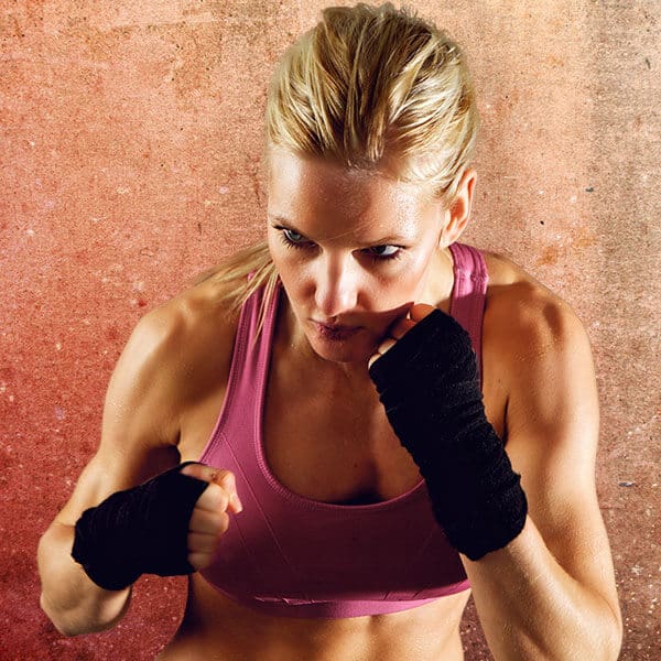 Mixed Martial Arts Lessons for Adults in Boise ID - Lady Kickboxing Focused Background