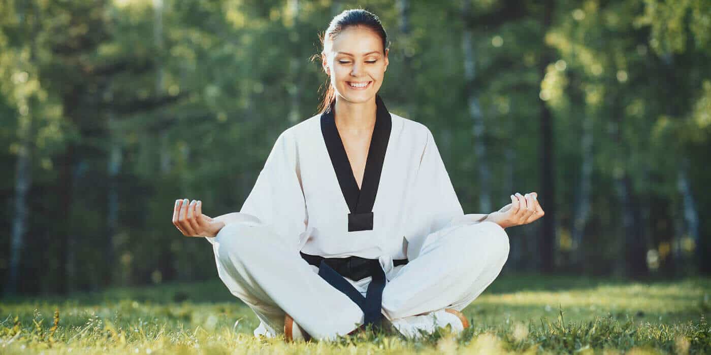 Martial Arts Lessons for Adults in Boise ID - Happy Woman Meditated Sitting Background